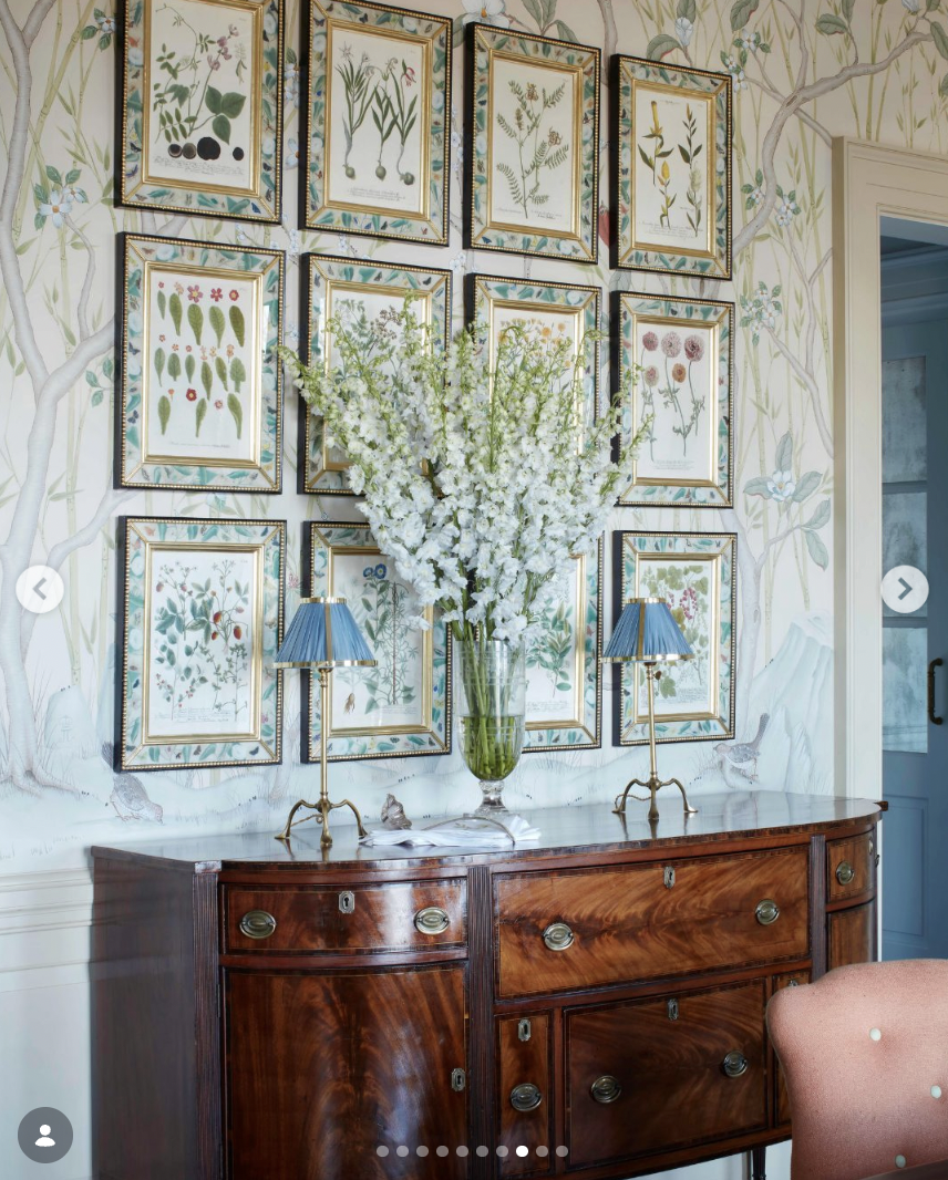 A floral photo gallery wall above a cabinet | Source: instagram/housebeautiful