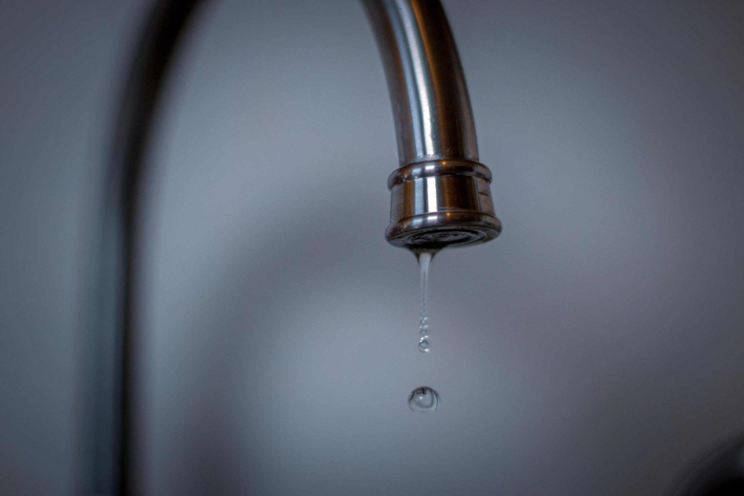 A dripping water faucet | Source: Getty Images