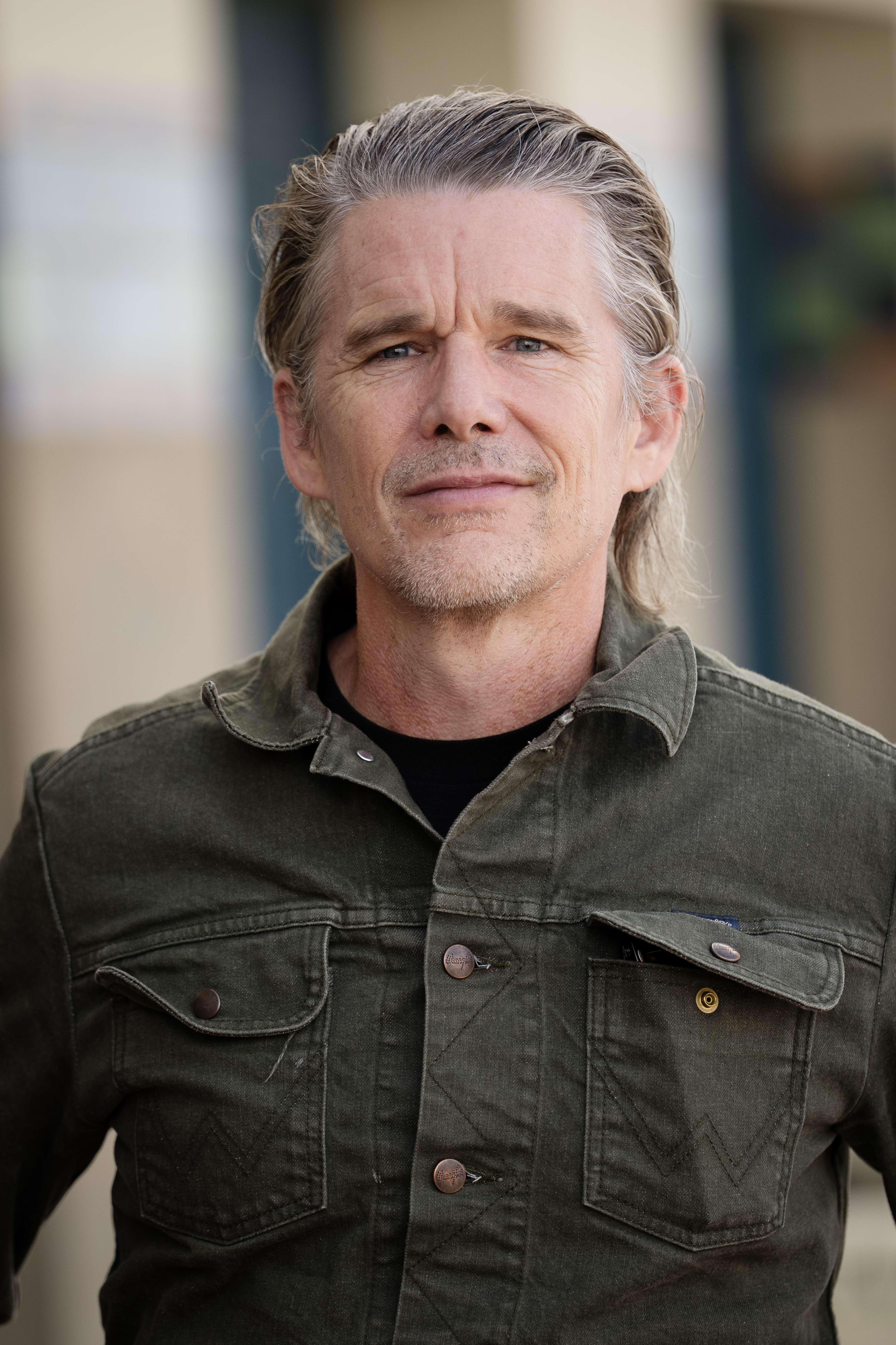 Ethan Hawke poses for the photographers after he unveiled his cabin sign along the Promenade des Planches at the 52nd Deauville American Film Festival on September 5, 2026 | Source: Getty Images