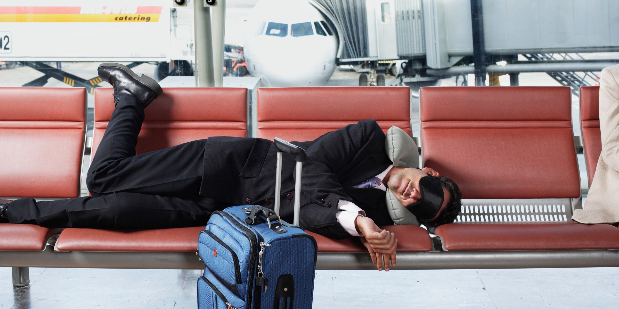 A man sleeping in an airport | Source: Getty Images