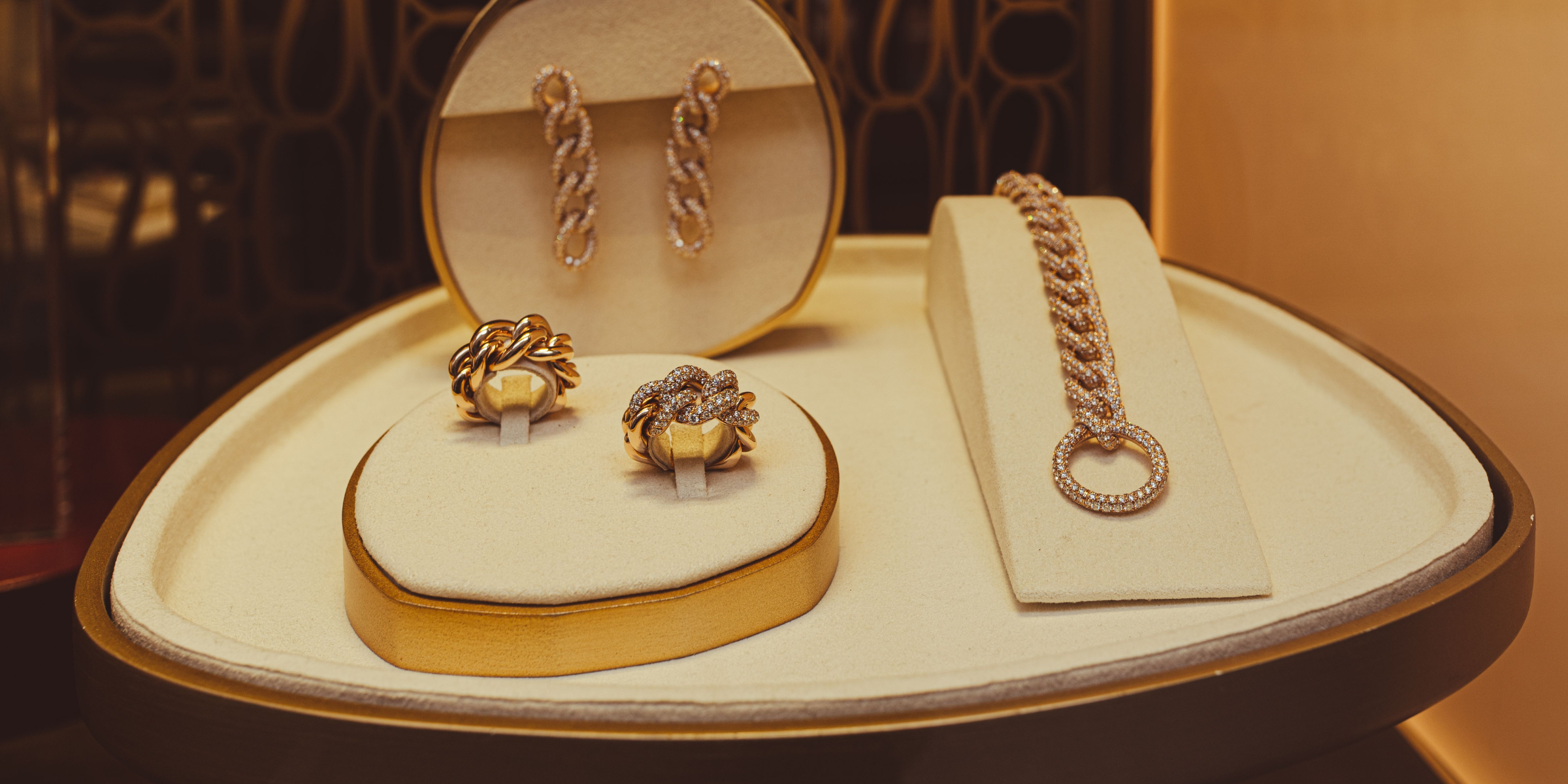 Gold jewelry in a display case | Source: Pexels