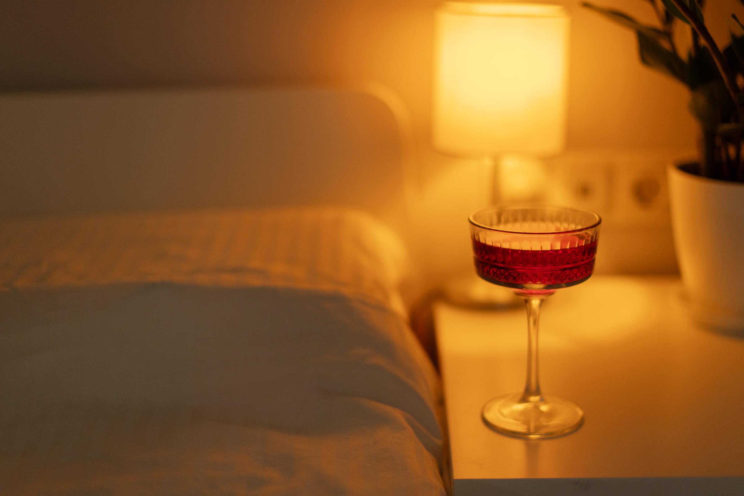 The Sleepy Girl Mocktail a glass stands on the bedside table | Source: Getty Images