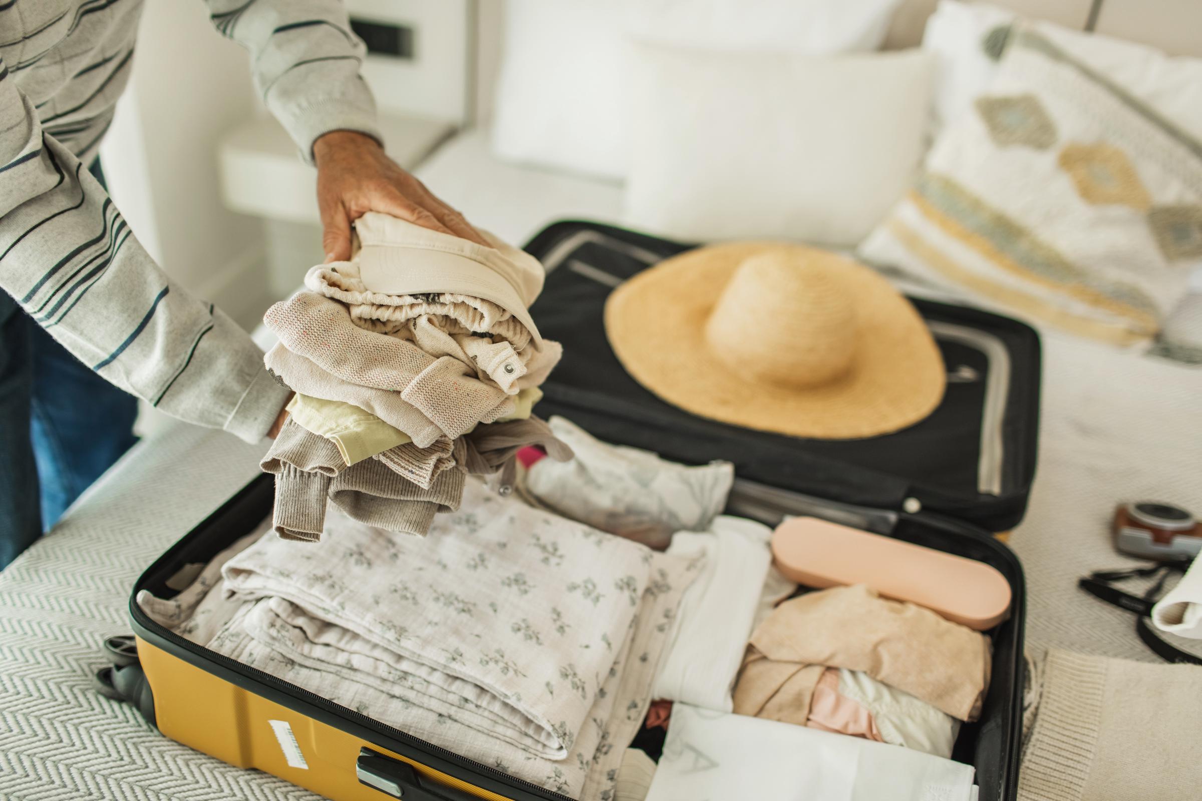 A woman packing for a trip | Source: Getty Images