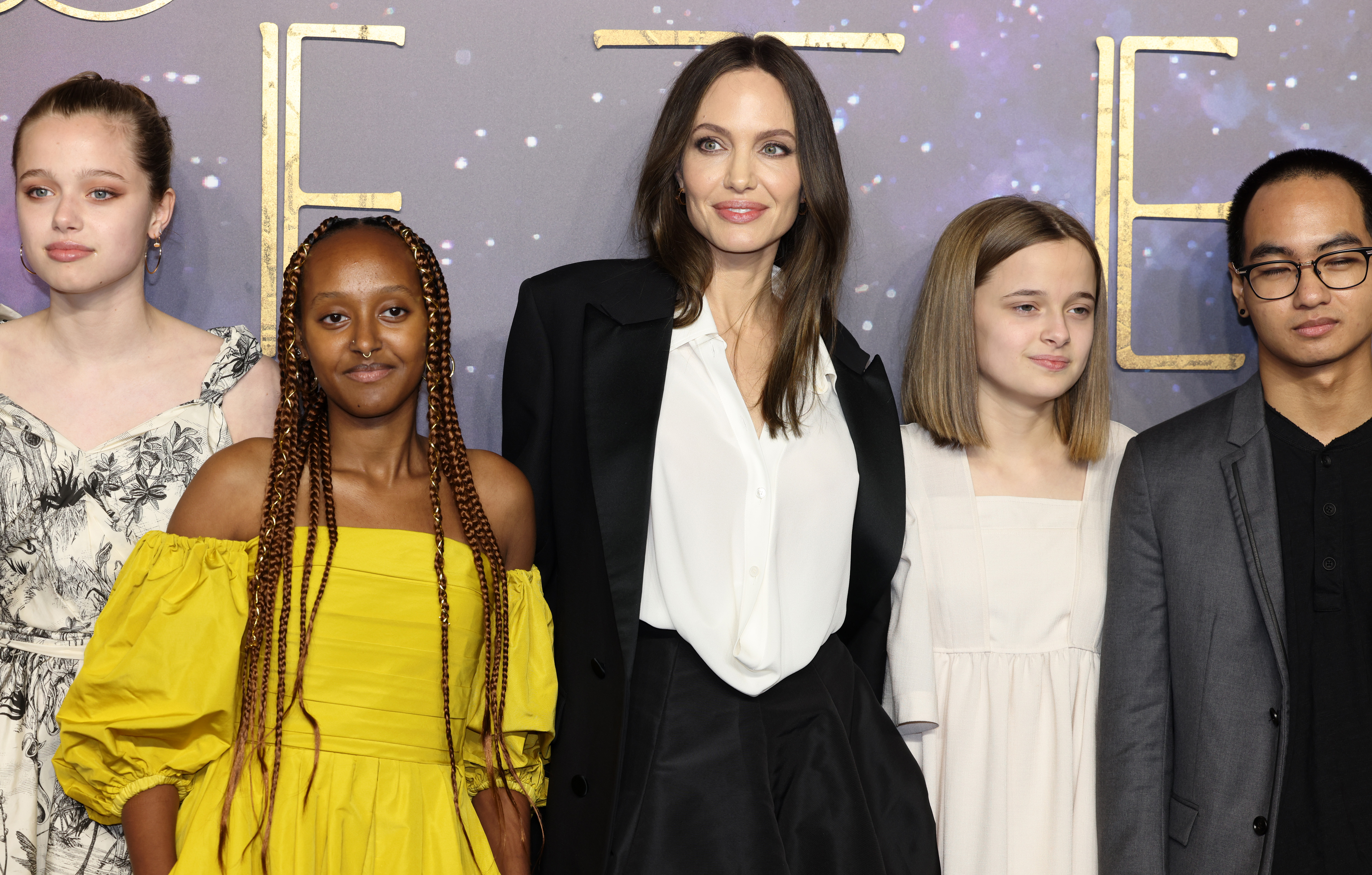 Angelina Jolie poses with Vivienne Jolie and her siblings at the UK gala screening of Marvel Studios' Eternals at BFI IMAX Waterloo in London on October 27, 2021. | Source: Getty Images