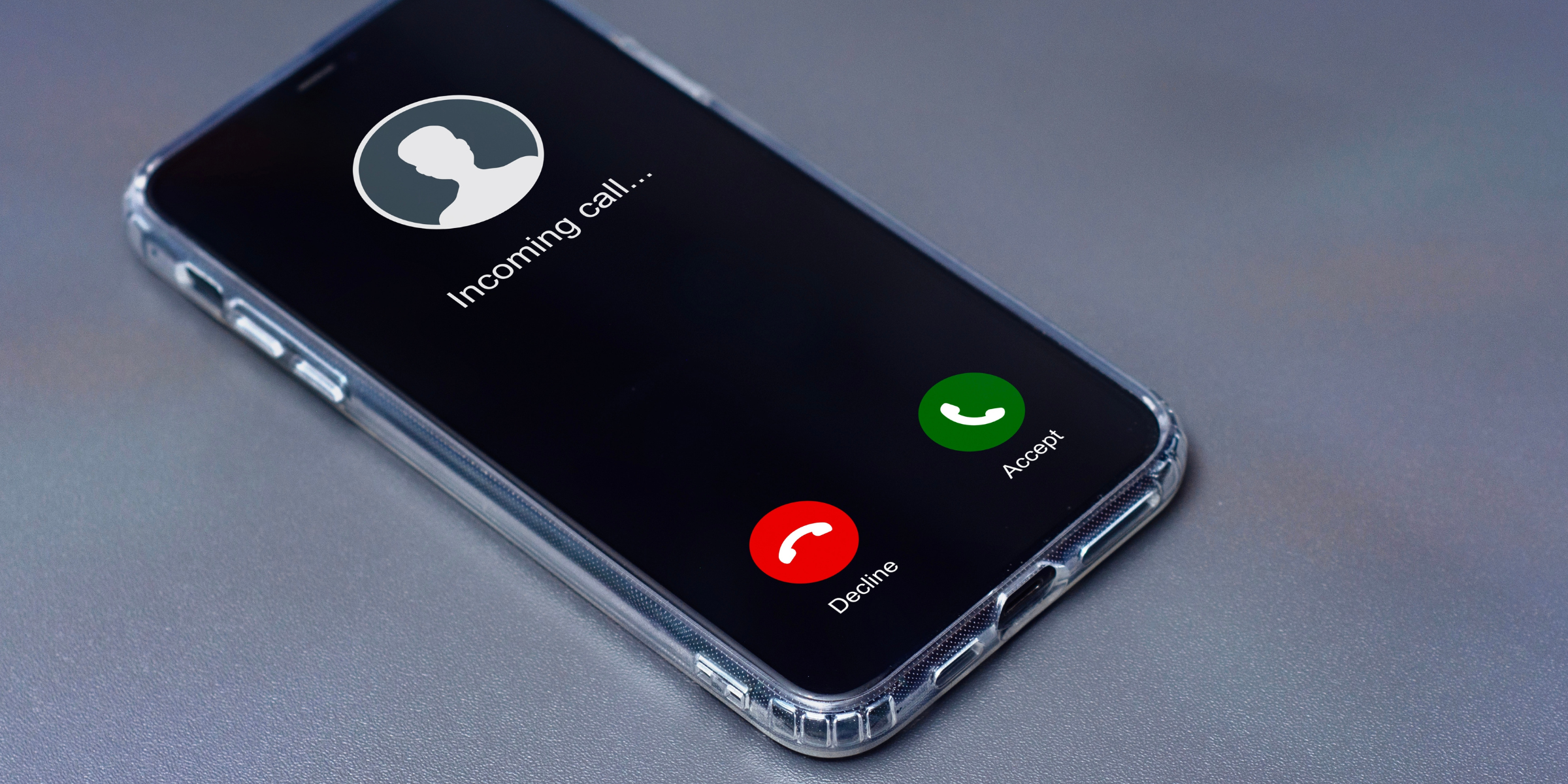 A smartphone displaying an incoming call | Source: Shutterstock