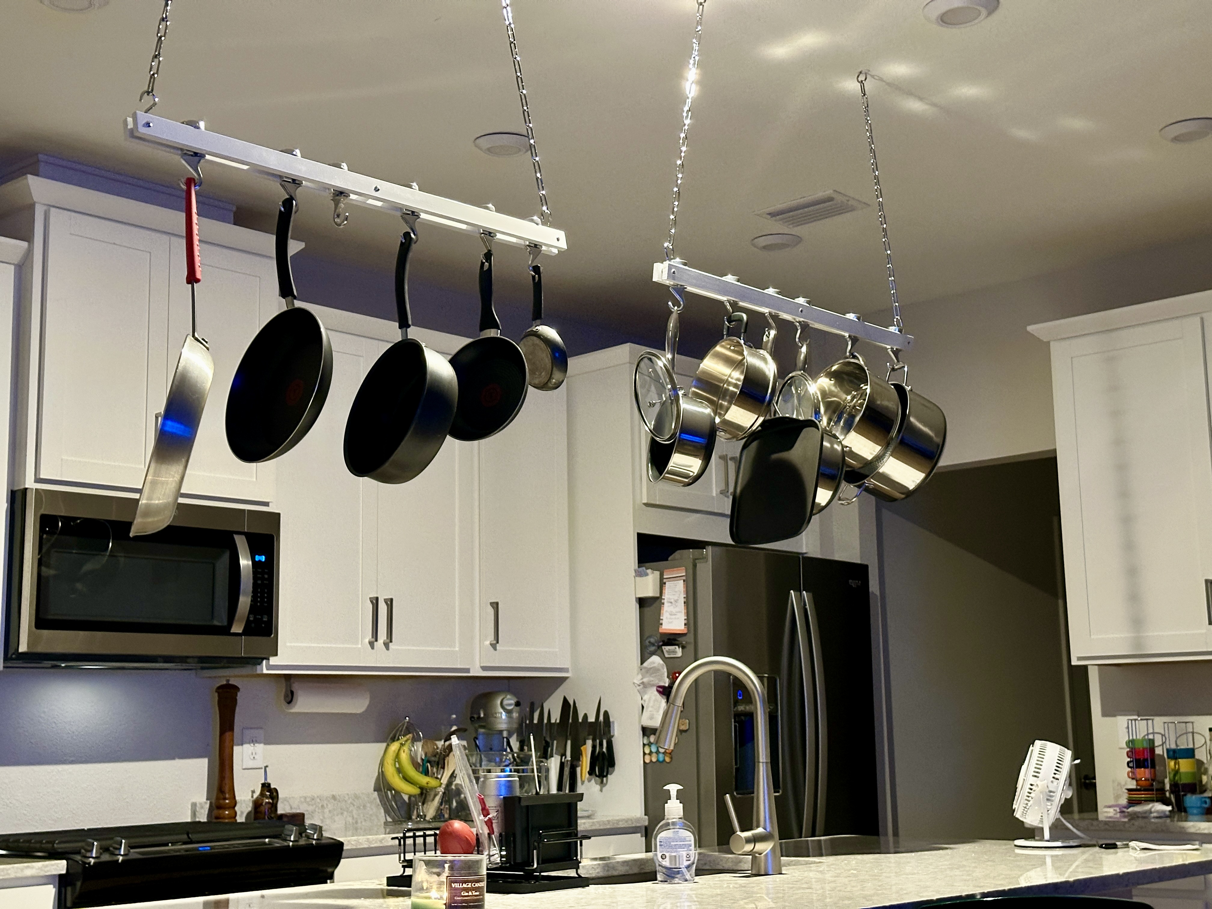 A pair of ceiling racks for pots and pans | Source: Getty Images
