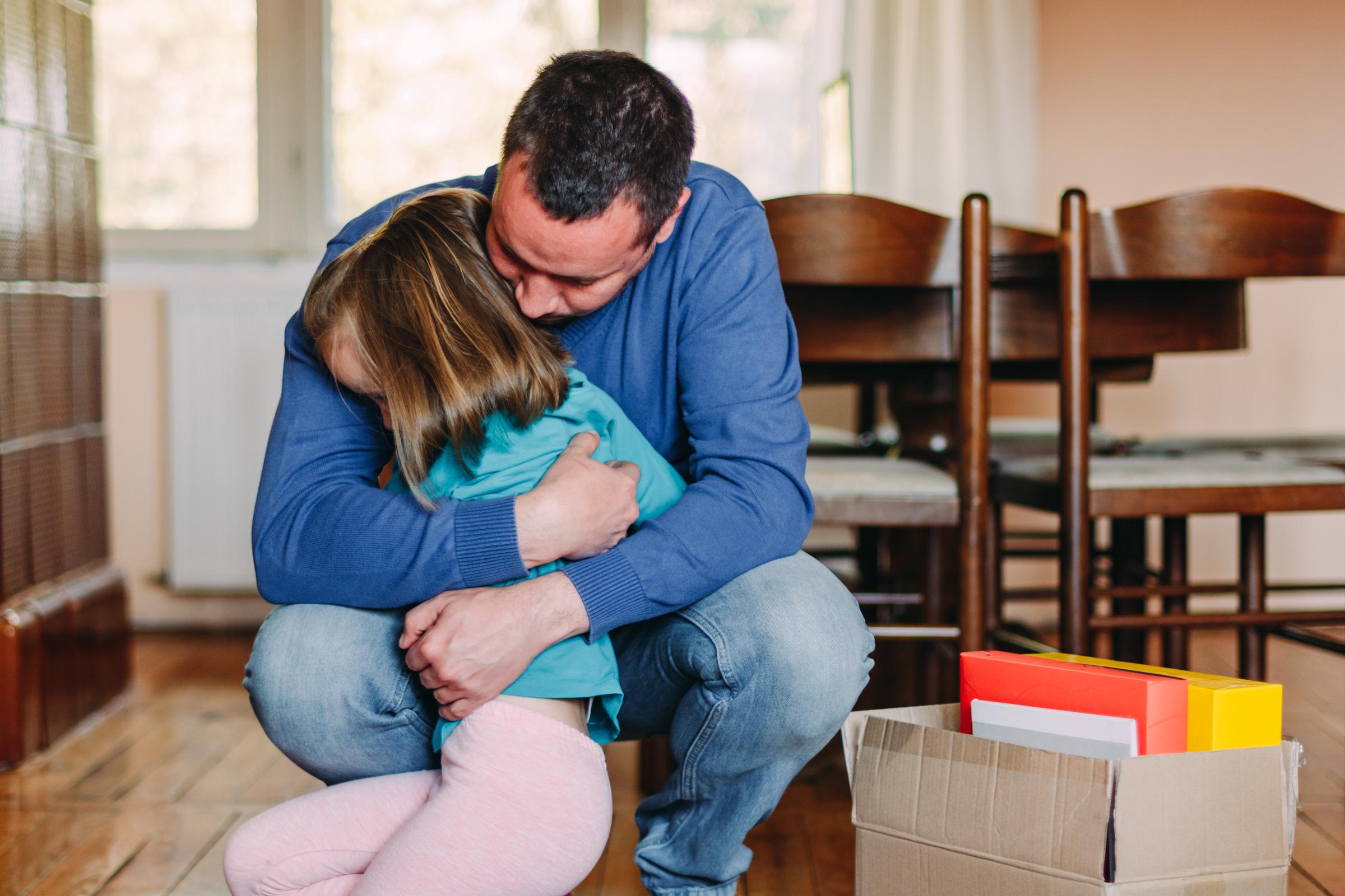 A father embracing his daughter | Source: Getty Images