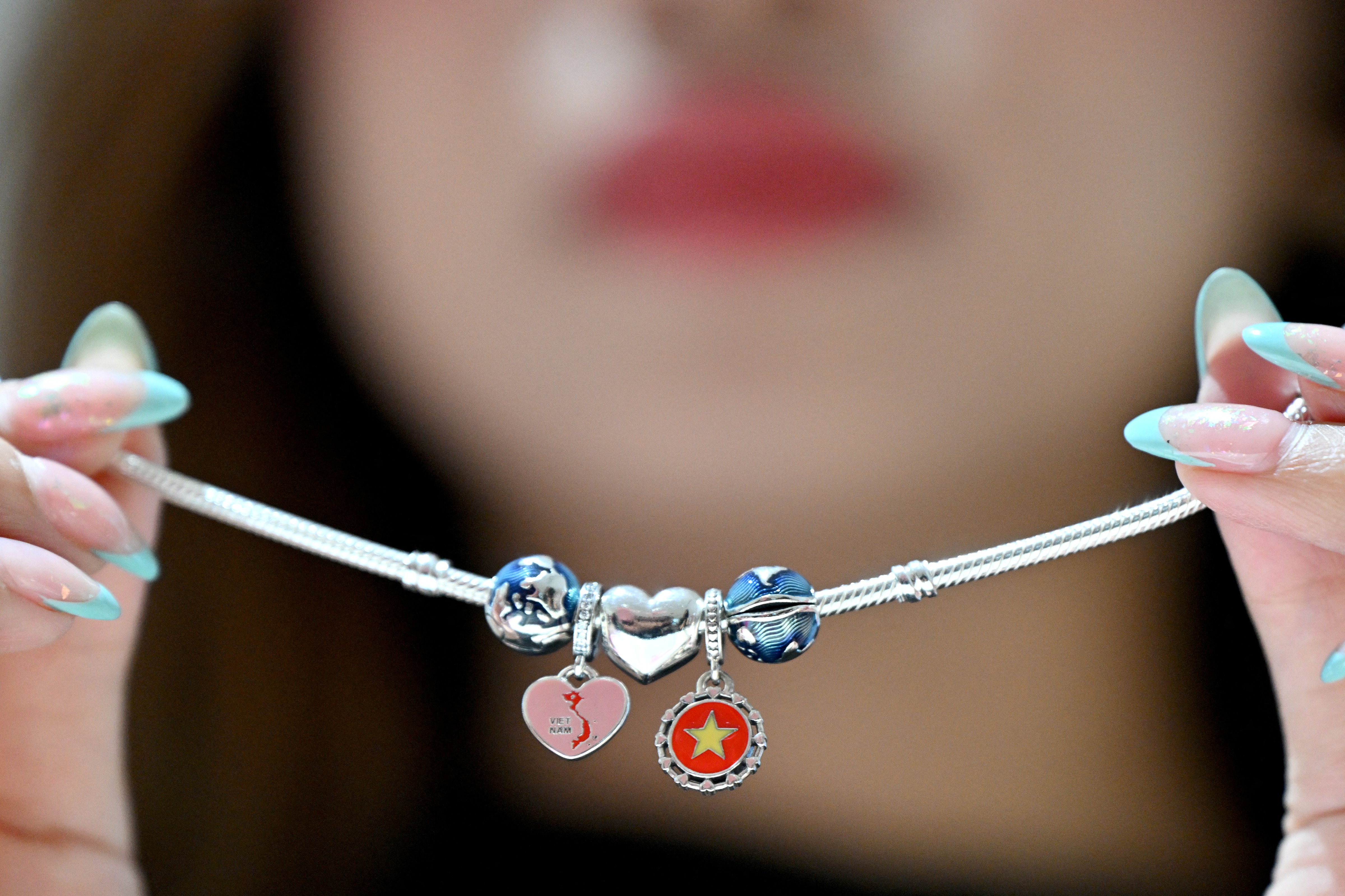 A Pandora bracelet with charms from Ho Chi Minh during a factory opening in the city on October 1, 2026 | Source: Getty Images