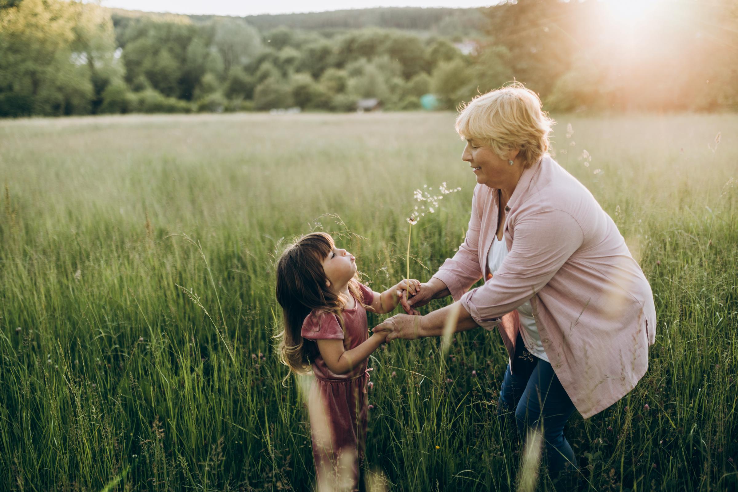 A grandmother playing with her granddaughter